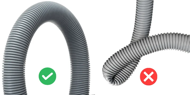 washing machine drain hose kinked or blocked with lint and debris